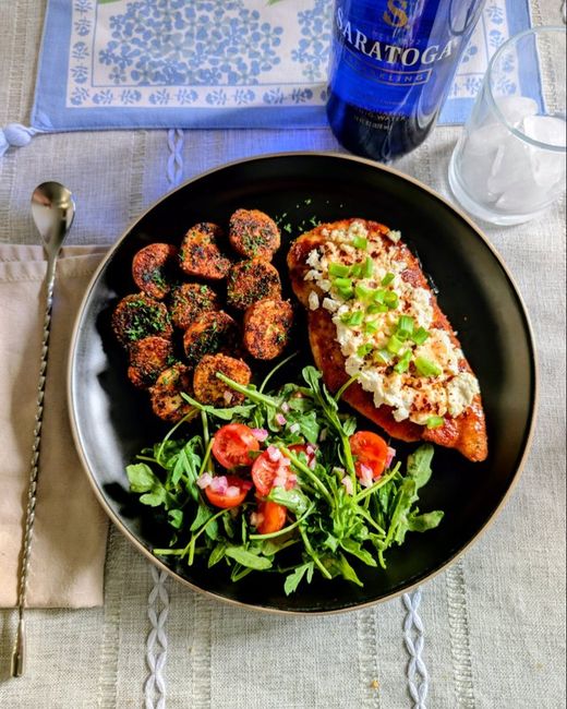 Chicken cutlets with hot honey and feta, roasted parmesan potatoes and a fresh salad